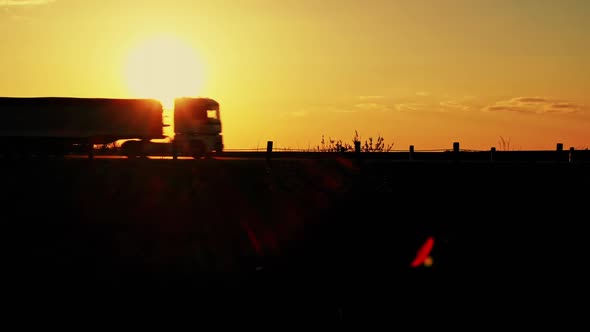 Truck Riding Against Sunset Sky