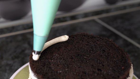 Confectioner Decorates Chocolate Cake