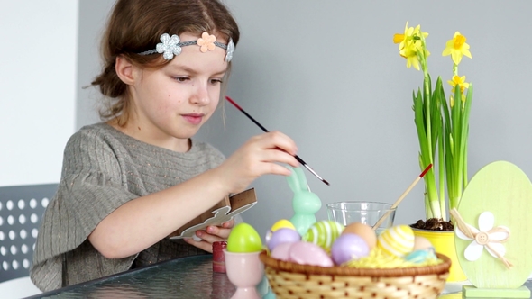 A Beautiful Girl Draws Gouache Happy Easter Preparing for the Holiday, Children's Creativity