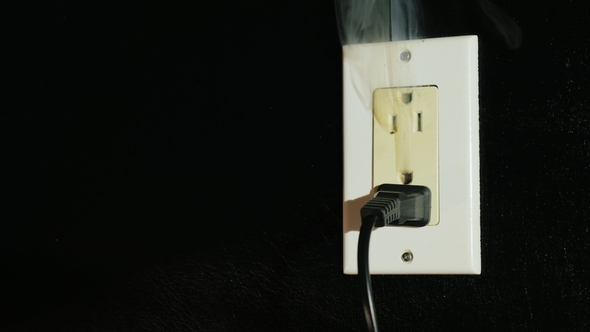 Fire in a Dual-socket US Type. Streams of Black Smoke Come From the Outlet. Danger To Life and