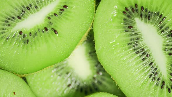 Slow Motion of Rotation Ripe Green Sliced Kiwi