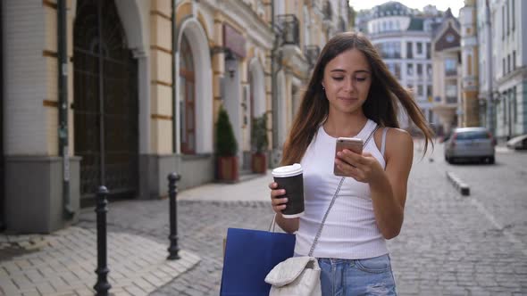 Smiling Cute Girl Networking on Phone Outdoors