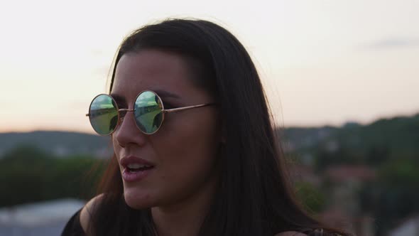 Girl with sunglasses singing