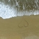 Young Woman Drawing Heart on Beach - VideoHive Item for Sale