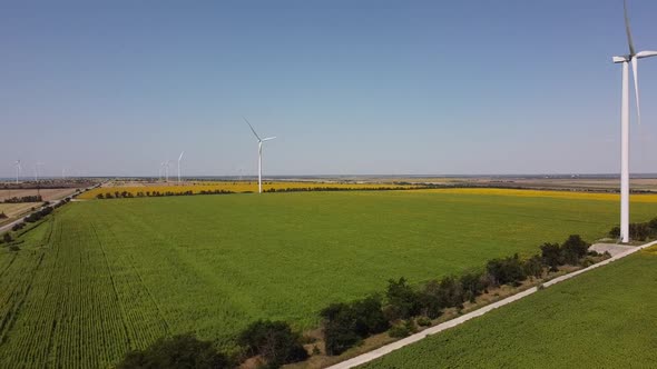 Aerial drone view of a flying over the wind turbine