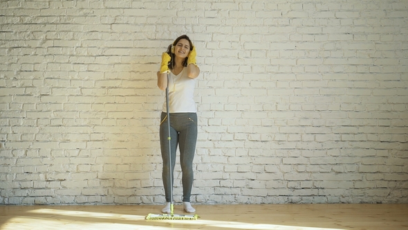 Beautiful Young Woman in Protective Gloves Is Singing 