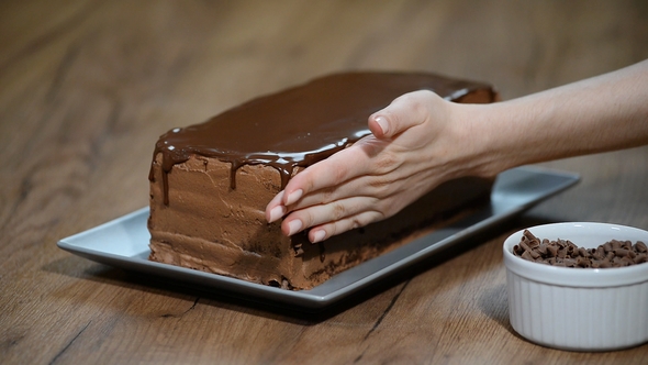 Pastry Chef Decorates a Chocolate Cake