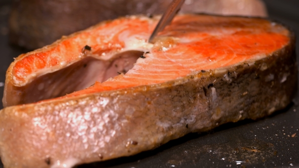 Slices of Red Fish Fried in a Pan