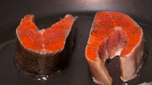 Slices of Red Fish Fried in a Pan