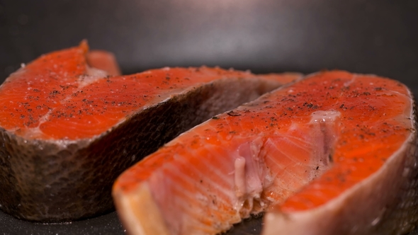 Slices of Red Fish Fried in a Pan