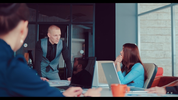 Executive Director Explains the Company To His Employees in the Office