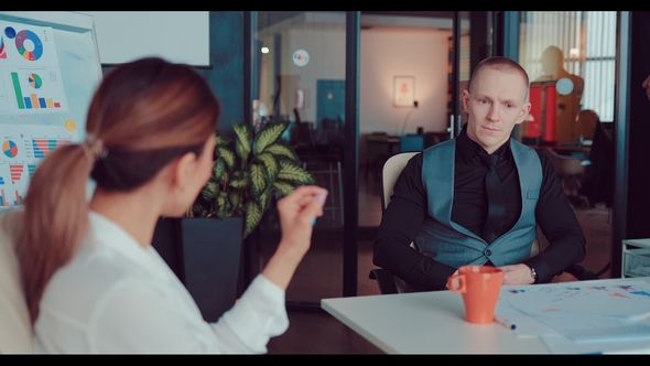 Businesswoman Discusses New Ideas and Plans with the Director in the Office