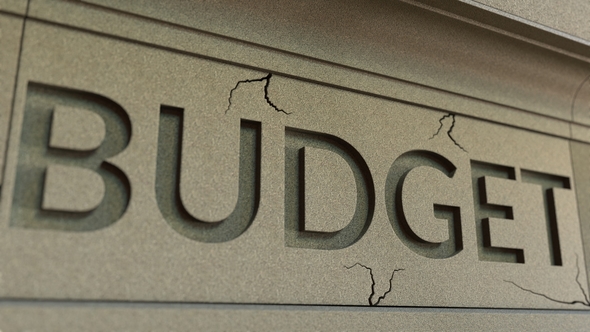 Cracking BUDGET Word on the Stone Facade alt