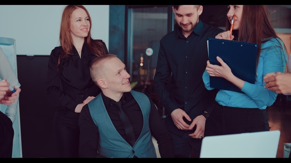 Handsome Young Director Communicates with Business Colleagues in a Modern Office