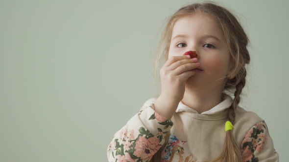 Little Girl Plays with Jelly Sweets