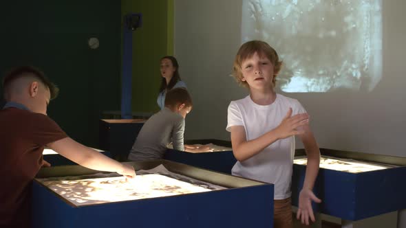 Kid Posing in Sand Animation Class