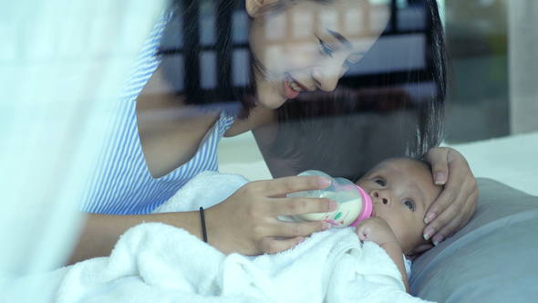 Beautiful Asian Mother With A Baby