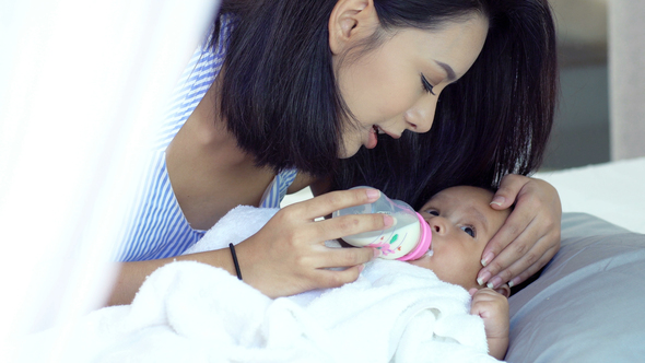 Beautiful Asian Mother With A Baby 