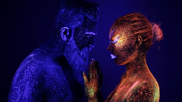 A Man and a Woman in the Ultraviolet Light Caress Each Other Fire and Ice, Two Hypostases