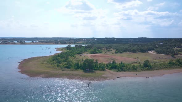 Aerial shots of a lake park in Texas on the popular Canyon Lake while barely any boats are cruising