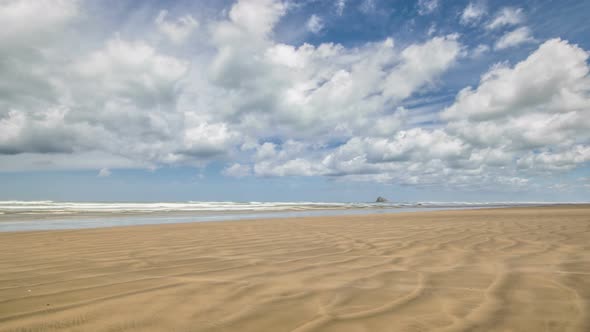 White Clouds Moving over Ninety Mile Beach in New Zealand wild Landscape