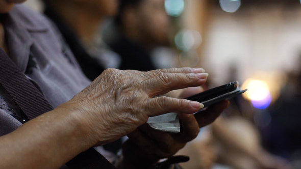 Old Lady Using a Mobile Phone 01