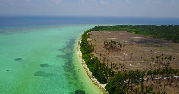 Luxury fly over tourism shot of a summer white paradise sand beach and aqua blue ocean background in