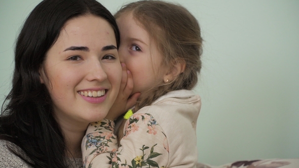 Mother and Little Daughter Trust Their Secrets To Each Other