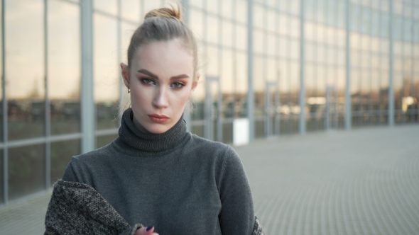 Businesswoman Looking at Camera Outside 