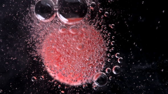 Round Candy Similar To a Tablet, Dissolves in Water, Releasing Bubbles