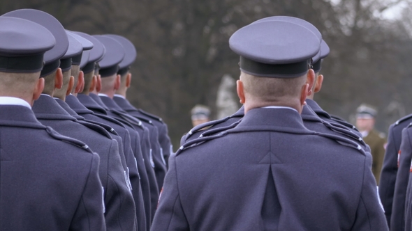 The Commander Gives Awards To Soldiers in Blue Uniform, Soldiers Stand with Their Backs To the