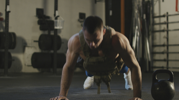 Sportsman Doing Push-ups in Gym