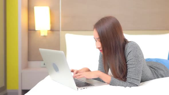 Young asian woman use laptop