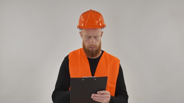 Red-haired Guy Wearing a Construction Helmet Portrait