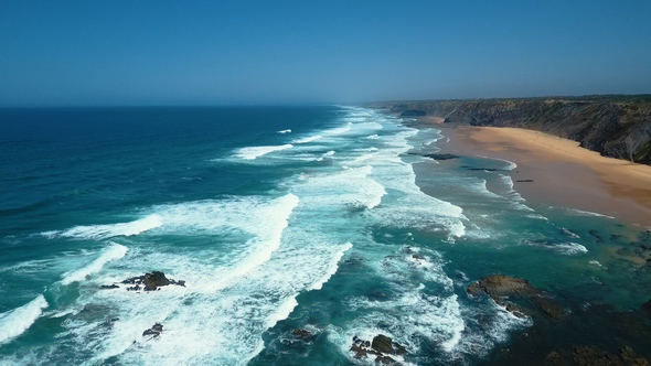 Aerial Footage of Ocean Waves Reaching Shore at West Coast Portugal