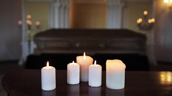 Burning Candles and Coffin in Church at Funeral 2