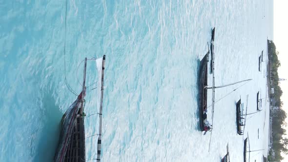 Tanzania Vertical Video  Boat Boats in the Ocean Near the Coast of Zanzibar Aerial View