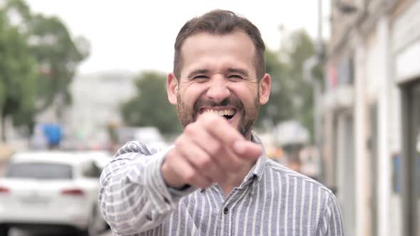 Outdoor Portrait of Laughing Young Man