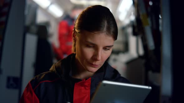 Paramedic Working on Tablet Computer