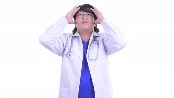 Stressed Overweight Asian Woman Doctor Getting Bad News