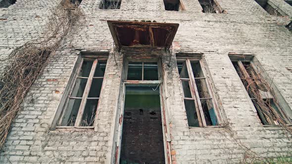 Abandoned building with broken windows in the war.
