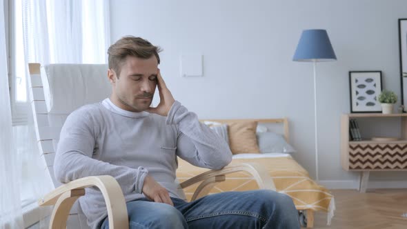 Headache, Tense Middle Aged Man Sitting on Casual Chair