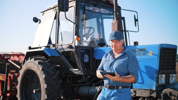 Farmer is Using Digital Tablet