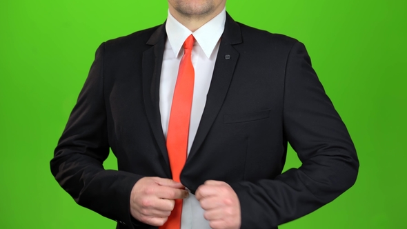 Businessman Upzips His Jacket and Unties His Tie