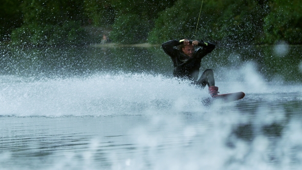 Wakeboarder Making Tricks on Waves During Movement 