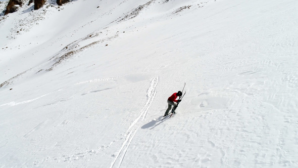 Skier Hiking Uphill