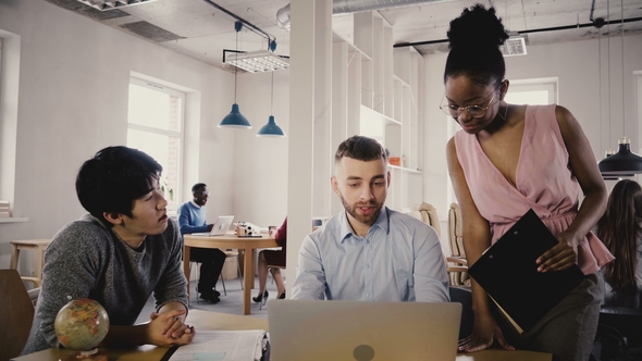 Camera Follows African American Woman Boss Enter Office, Give Directions To Workers. Multiethnic