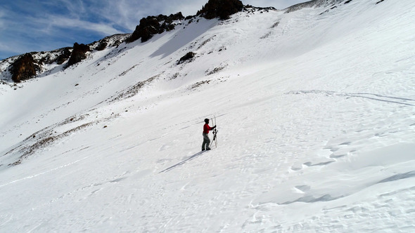 Skier Walking in the Snowy Target