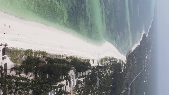 Vertical Video of the Ocean Near the Coast of Zanzibar Tanzania Aerial View