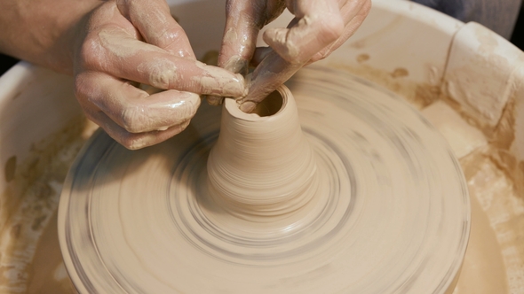 Man Works with a Potter's Wheel, Only Hands